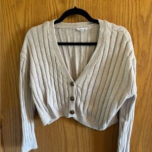 Tan cardigan.